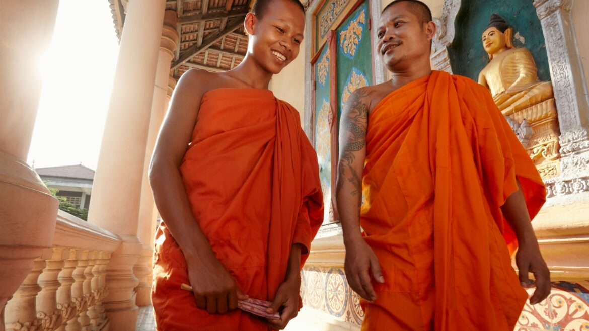 Two monks in Phnom Penh in Cambodia, included in tours offered with Asia Vacation Group