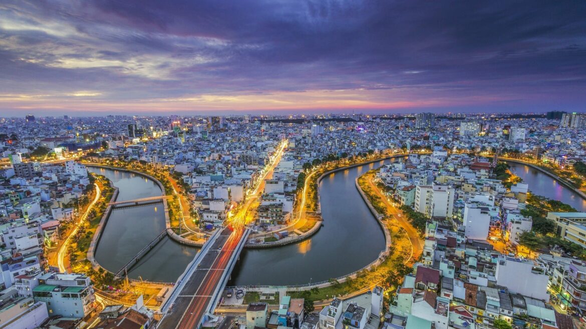 Aerial view of Saigon River at night in VIetnam,, included in tours offered by Asia Vacation Group