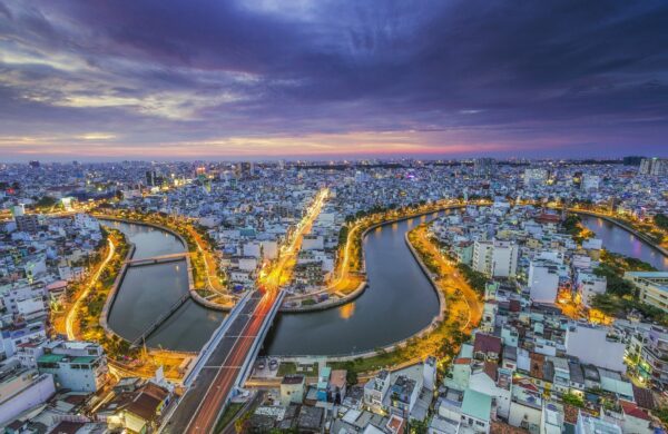 Aerial view of Saigon River at night in VIetnam,, included in tours offered by Asia Vacation Group