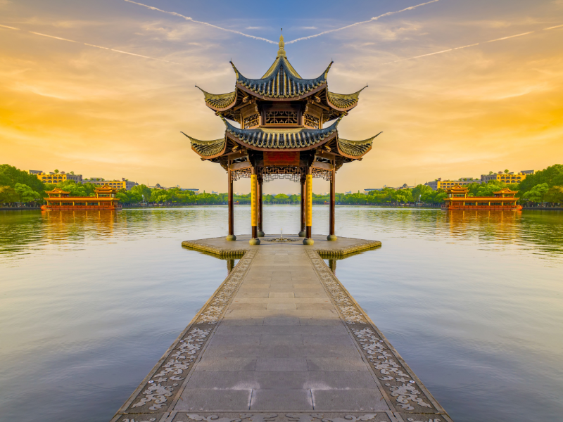 West Lake in Hangzhou is surrounded by ancient buildings and lush gardens