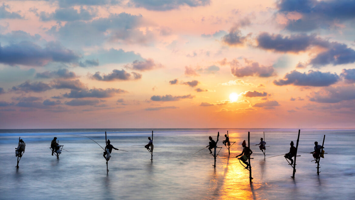 fishermen-on-stilts-in-silhouette-at-the-sunset-in-galle